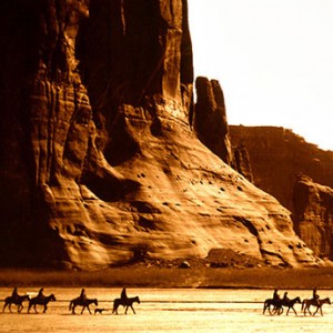 riding horses in a Western landscape